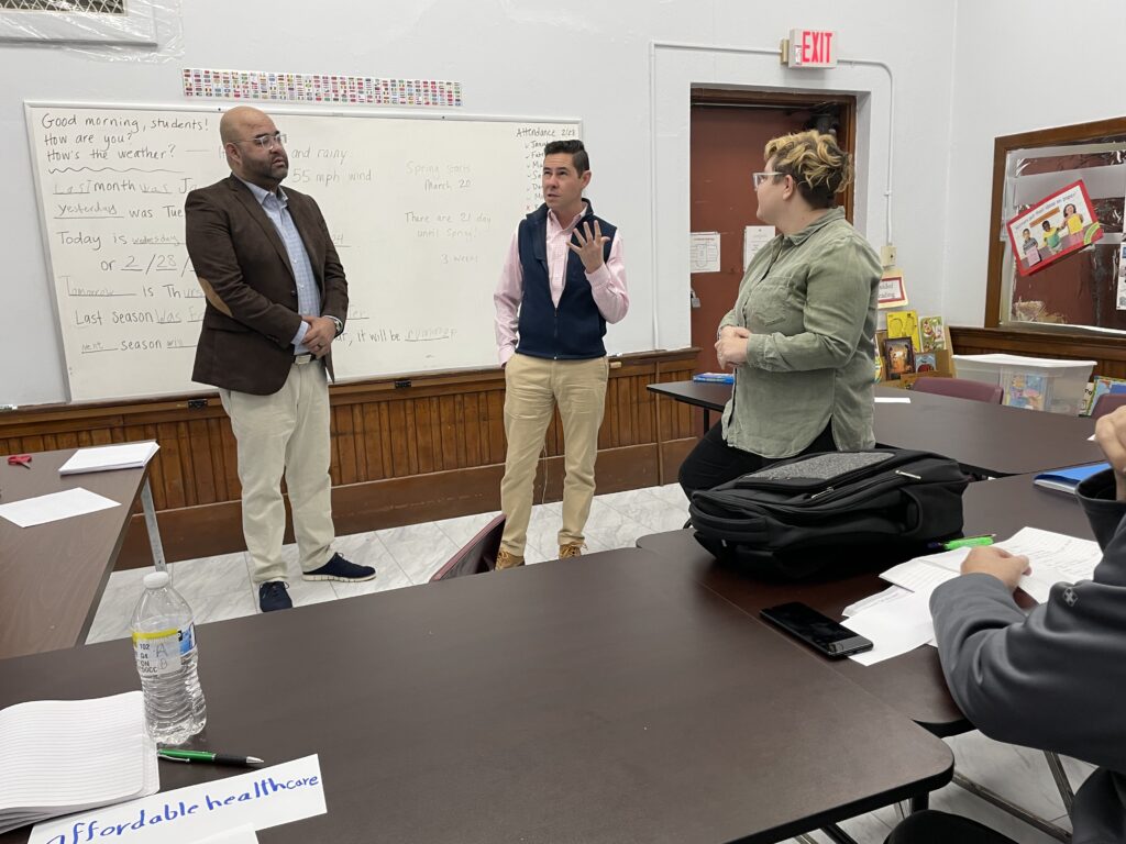 State senators Adam Gomez (left) and Jacob Oliveira (center) with teacher Ash (right) in classroom