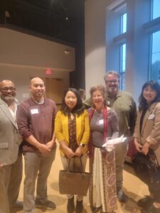 board members, director laurie millman, and honorees standing together at 2024 annual meeting